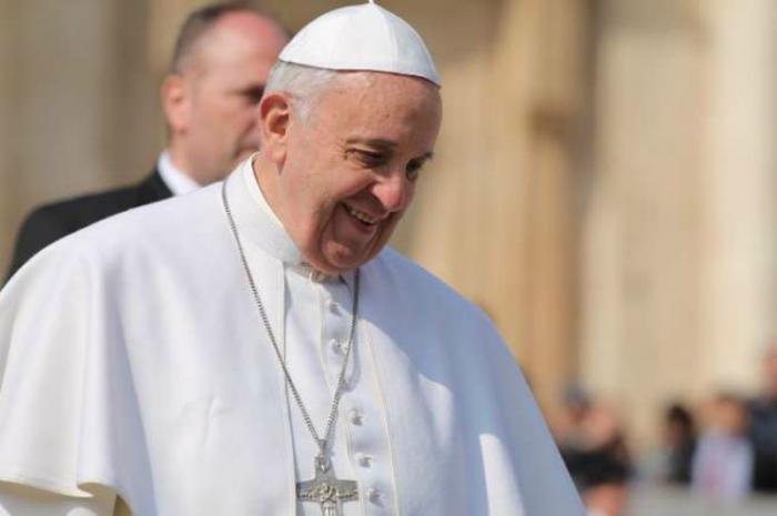 Pope Francis greets pilgrims during his March 11, 2015 general audience in St. Peter's Square.