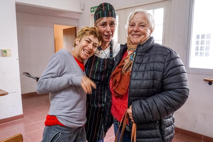 Graciela Ferrari (left) regularly visits Centro de Dia, a center run by local nonprofit Fundacion IPNA. She has befriended Sonia Trabichet (center), a cook, and comes to the center with her mother, Beatriz Rueco (right).